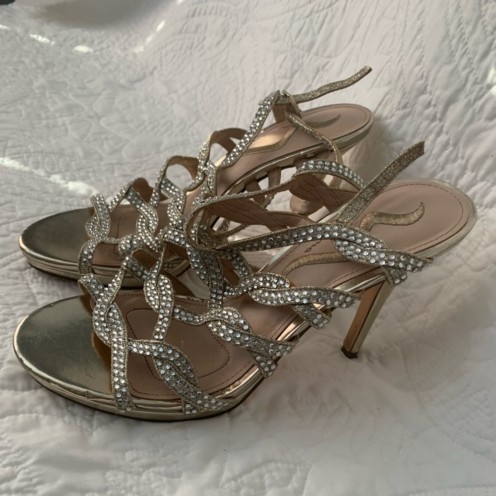 Dressy strappy open toed shoes. Golden with rhinestones. Very pretty!